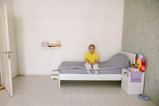 Young woman on the bed.
