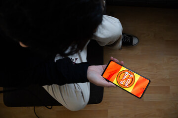 Top View of User with Restricted Social Media Access on Mobile Device