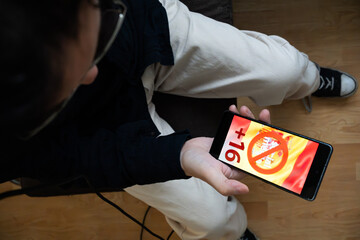 Top View of User with Restricted Social Media Access on Mobile Device