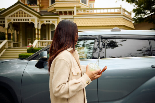 A woman strolls through the suburbs