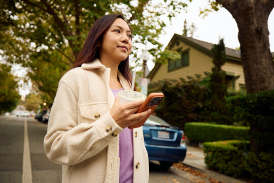 Woman walks in the suburban neighborhood