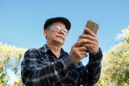 using mobile phone outside sky