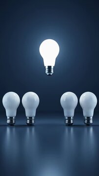 Single glowing light bulb rising above a row of unlit lamps in a cinematic 3D animation, symbolizing innovation and standing out from the crowd on a dark blue background.