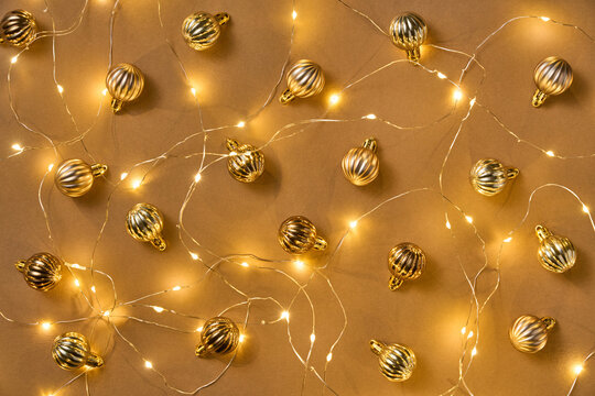 Gold bauble toys and fairy light Christmas background