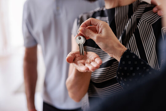 New home keys are handed to a happy couple.
