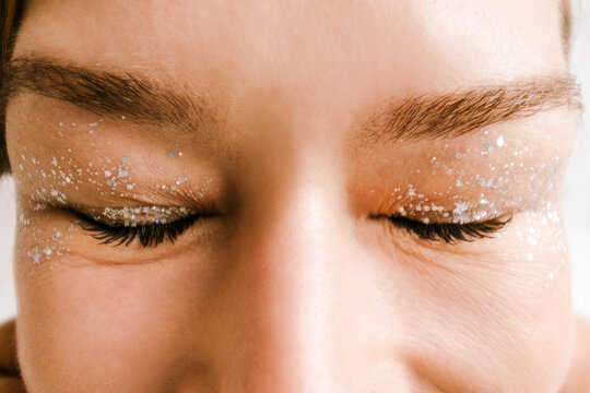 Woman with glitter on her eyelids.