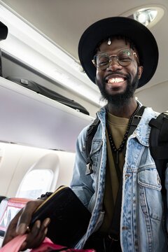 Happy man traveling on airplane flight trip