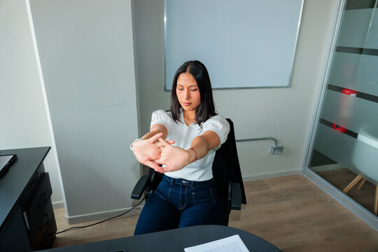 Woman Doing Forward Stretch During Office Break