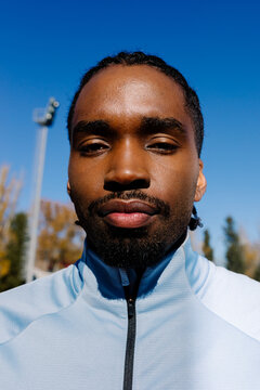 Closeup of an athlete witn an expression that conveys dedication