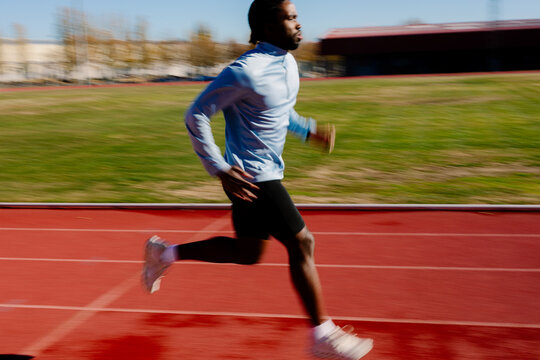 Blurred shot due to the movement of a runner training