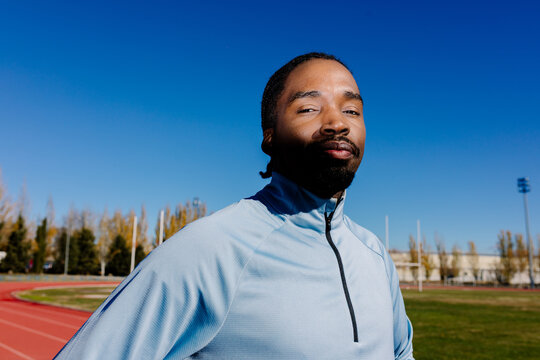 Portrait of a runner striking a confident pose radiating energy