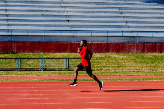 A seasoned athlete powering through swift sprint efforts