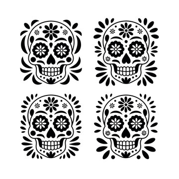 A set of four black and white sugar skulls with floral designs on a white background