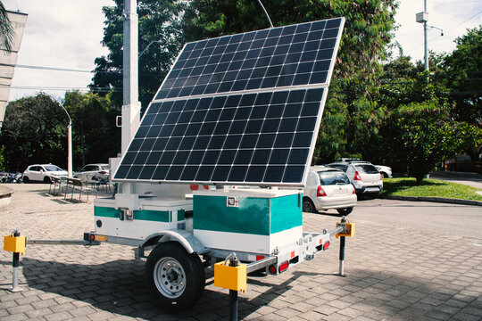 Solar Panel Setup in a City Park Near a Road
