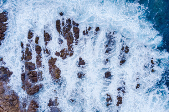 Aerial Over Rocky Island Of Coast