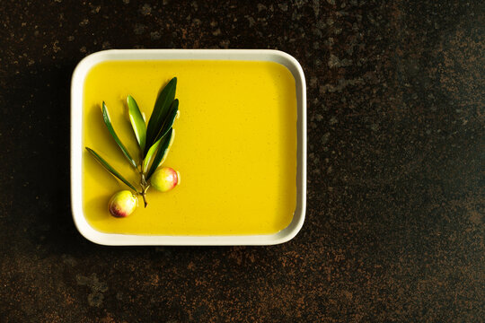 Olive and olive oil in plate