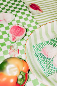 Food on checked tablecloth with vegetables