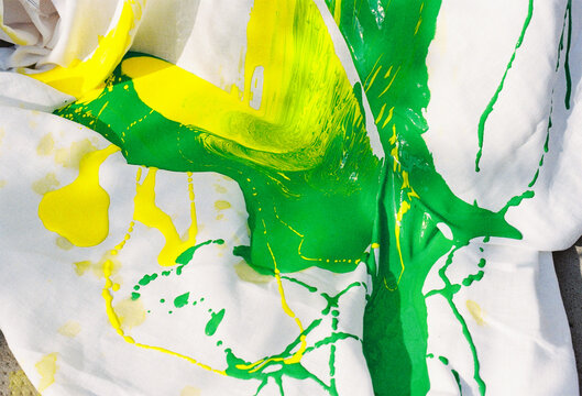 Colorful Paint Splashes on White Fabric Create Bold Patterns