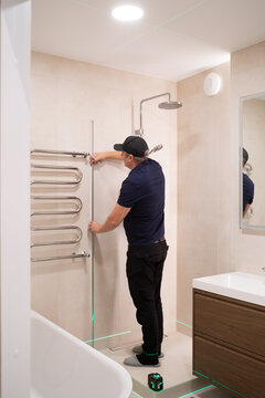 Handyman Installs Shower Door Frame 