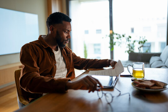 Man reading at home afternoon

