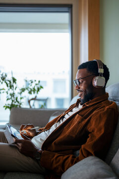 Man takes notes while music plays
