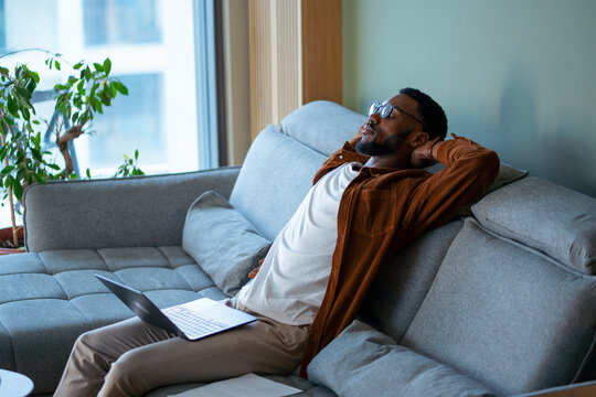 Man on couch with laptop

