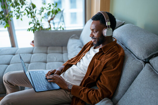 Man with laptop and headphones

