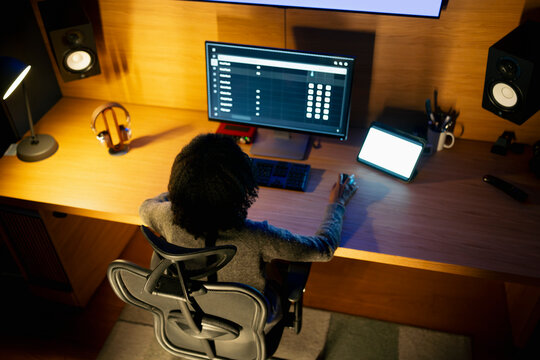 Person working at a desk with technology
