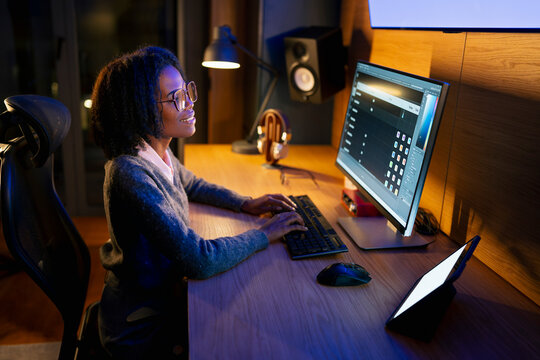 Working on a computer at night
