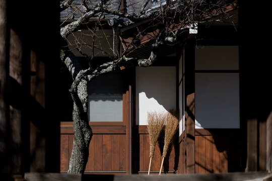 Brooms and Light in a Japanese Courtyard.