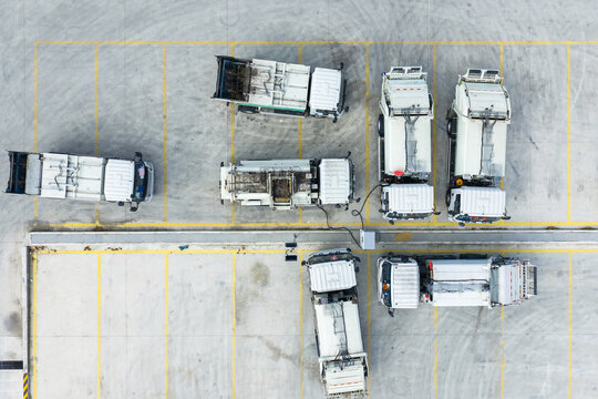 Aerial view of electric sanitation truck charging