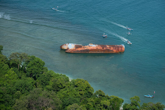 Rusted Shipwreck in Coastal Waters