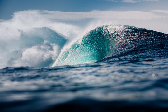 Expansive ocean view captures huge wave in the shoreline of Lanzarote