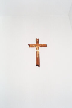 Christ on a cross hanged on a white wall
