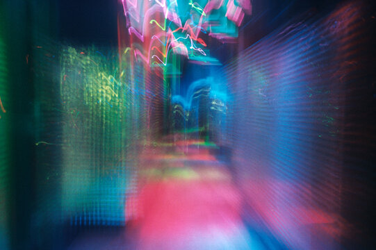 A blurry corridor with vibrant colors