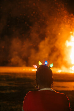 Woman in Christmas Lights at Algiers Holiday Bonfire New Orleans