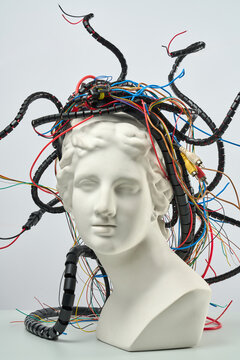 Vertical photo of statue with wires