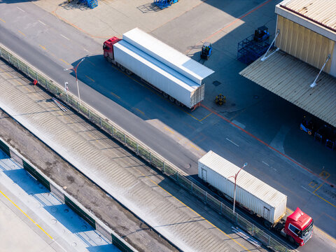 Aerial view of container trucks at factory