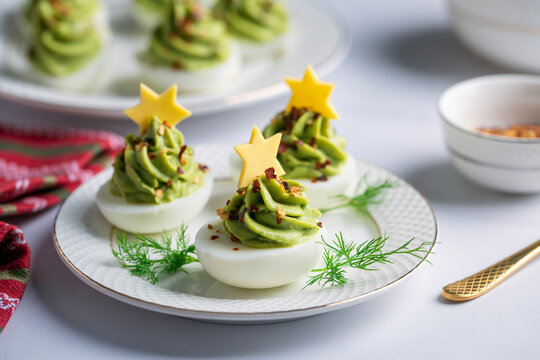 Avocado stuffed eggs. Holiday edition