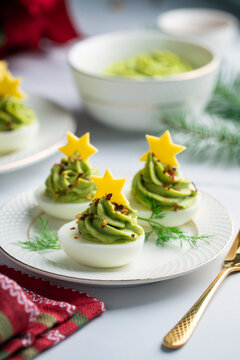 Avocado stuffed eggs. Holiday edition