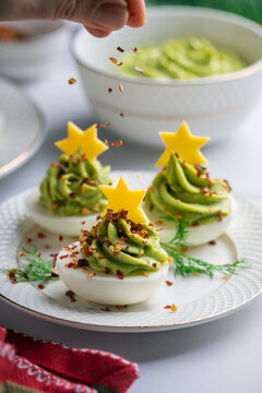 Avocado stuffed eggs. Holiday edition