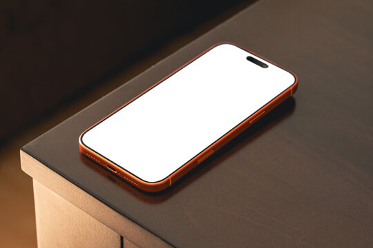 Smartphone placed on a table in an interior setting at night