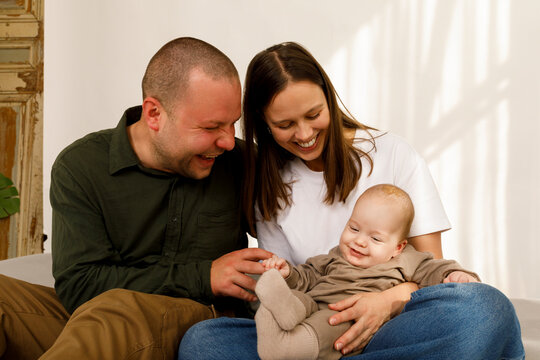 Happy Family Shares Moment With Baby 
