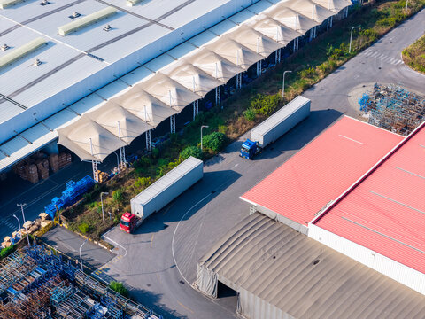 Aerial view of container trucks at factory