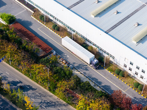 Aerial view of container trucks at factory