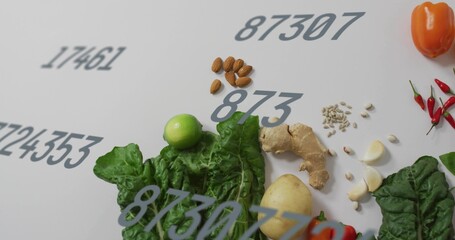 Showing flat lay of food on white table, with greens potato ginger seeds chilis gray digits © vectorfusionart