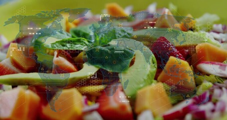 Fototapeta premium Showing colorful salad on shallow bowl at studio table with avocado, mango, strawberry, HUD overlay