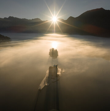 Morning fog in the Bay of Kotor at sunrise, aerial view