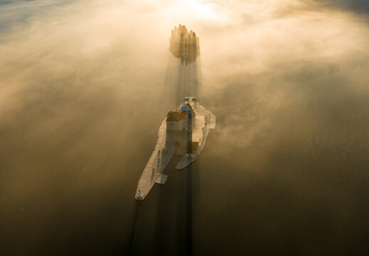 Twin Island Churches in Golden Fog in Perast, drone photo 