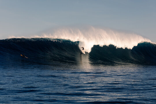 Surfer riding a giant wave near the Canary Islands